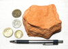 sandstone  -  teaching hand/display specimen of the Navajo Sandstone, a fine-grained orange-pink aeolian sandstone