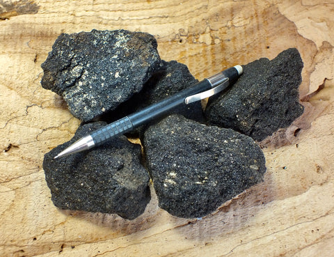 oil sand - Graciosa coarse-grained member of the Careaga sandstone impregnated with oil from the underlying Monterey Formation - Unit of 5 student specimens