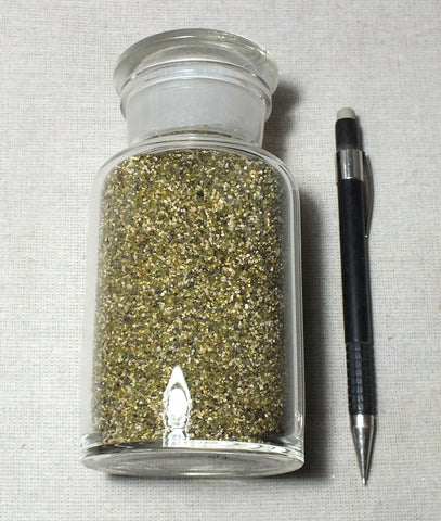 sand - sand with grains derived from olivine weathered from basalt and coral from an offshore reef - 250 ml glass display bottle with ground-glass stopper