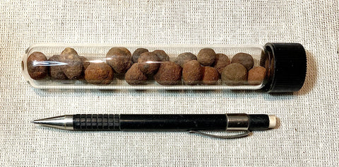 concretions - ironstone concretions from the Lindavista Fm - an earth analog of the Mars "blueberries" in a Pyrex tube