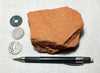 sandstone  -  teaching hand specimen of the Navajo Sandstone, a fine-grained orange-pink aeolian sandstone