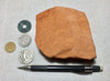 sandstone  -  teaching hand specimen of the Navajo Sandstone, a fine-grained orange-pink aeolian sandstone