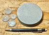 sandstone - medium grained gray - 4" diameter oil well core slice from the Stevens Sand - hand specimen