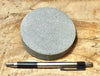 sandstone - medium grained gray - 4" diameter oil well core slice from the Stevens Sand - hand specimen