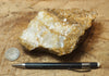 calcite - teaching hand/display specimen of massive white and naturally-brown  calcite