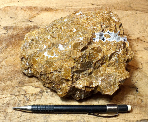 calcite - teaching hand/display specimen of massive naturally-brown calcite