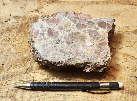 caliche - caliche from the Great Basin Desert incorporating angular fragments of other rocks - hand specimen