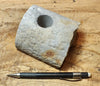 oil well core section that has been plugged and cut in half - an unusual example