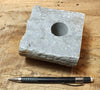 oil well core section that has been plugged and cut in half - an unusual example