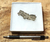 fulgurite - natural glass flanged tube formed by lightning strike on sand from the Western Sahara in Morocco
