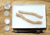 fulgurite - pair of longer than average natural glass tubes formed by lightning strikes on sand
