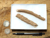 fulgurite - pair of longer than average natural glass tubes formed by lightning strikes on sand