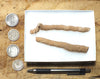 fulgurite - pair of longer than average natural glass tubes formed by lightning strikes on sand