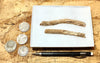 fulgurite - pair of longer than average natural glass tubes formed by lightning strikes on sand