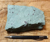 tuff - copper-stained green welded tuff - teaching hand/display specimen