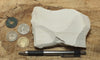 magnesite - teaching hand specimen of light tan porous magnesite - Windous magnesite deposit, Westvaco Mine