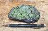 peridotite xenolith in vesicular phonotephrite from the San Carlos Volcanic Field, Arizona - teaching hand specimen