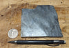phyllite - hand specimen of a silvery gray Paleozoic phyllite