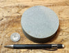 sandstone - medium grained gray - 4" diameter oil well core slice from the Stevens Sand - hand specimen