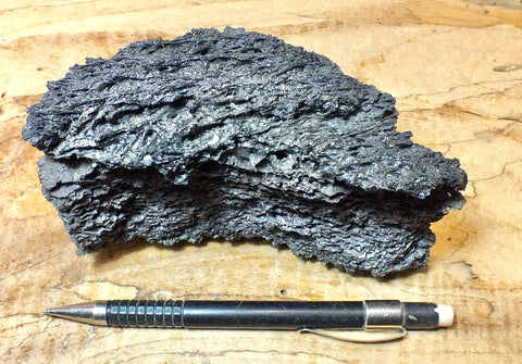 tachylite - tachylite crust over vesicular basalt from the surface of the 2018 Kilauea flow that destroyed Kapoho, Hawaii - hand/display specimen