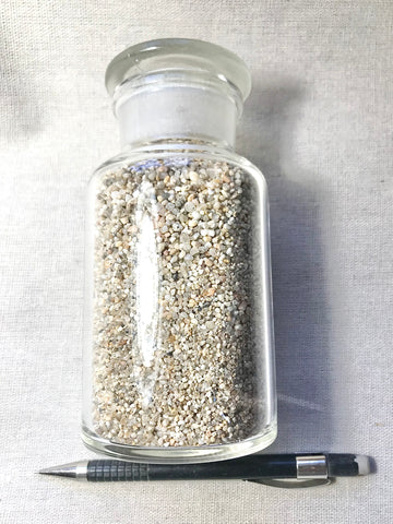 sand - large-grained quartz dune sand from Monastery Beach, Carmel Bay, California in a 250 ml display bottle with ground glass stopper