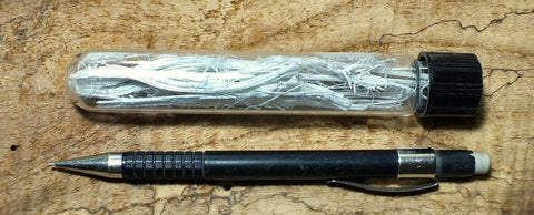 asbestos - tremolite (amphibole) asbestos - teaching hand specimen of fibers in a screw-cap pyrex tube